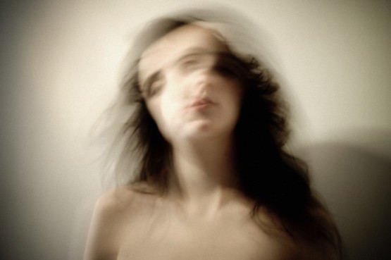 Montevideo, Uruguay --- Close-up of a young woman shaking her head --- Image by © WIN-Images/Corbis